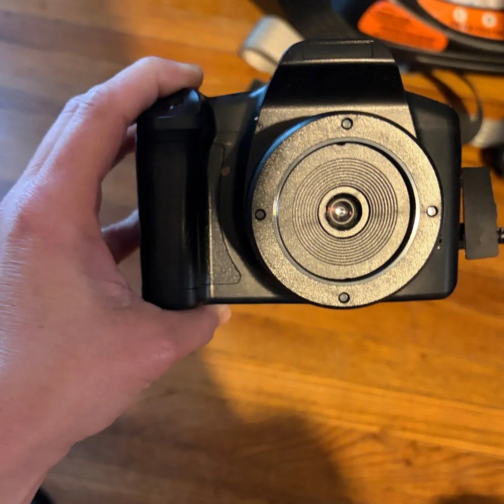 Black Compact Digital Camera with Lens Cap and SD Card